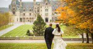 a couple gets married in the fall at the biltmore estate