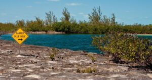 a danger sign for a blue hole in the bahamas