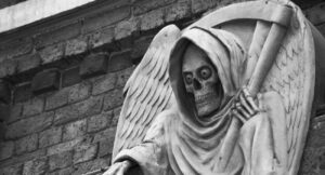 death statue outside the London Dungeon, UK