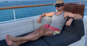 Man sitting on a cruise ship deck chair