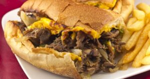 a philly cheesesteak with fries