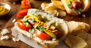 a chicago-style hot dog with chips