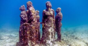 a statue at the underwater museum of art in cancun