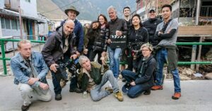 anthony bourdain on set with his cast and crew
