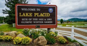 the welcome to lake placid sign